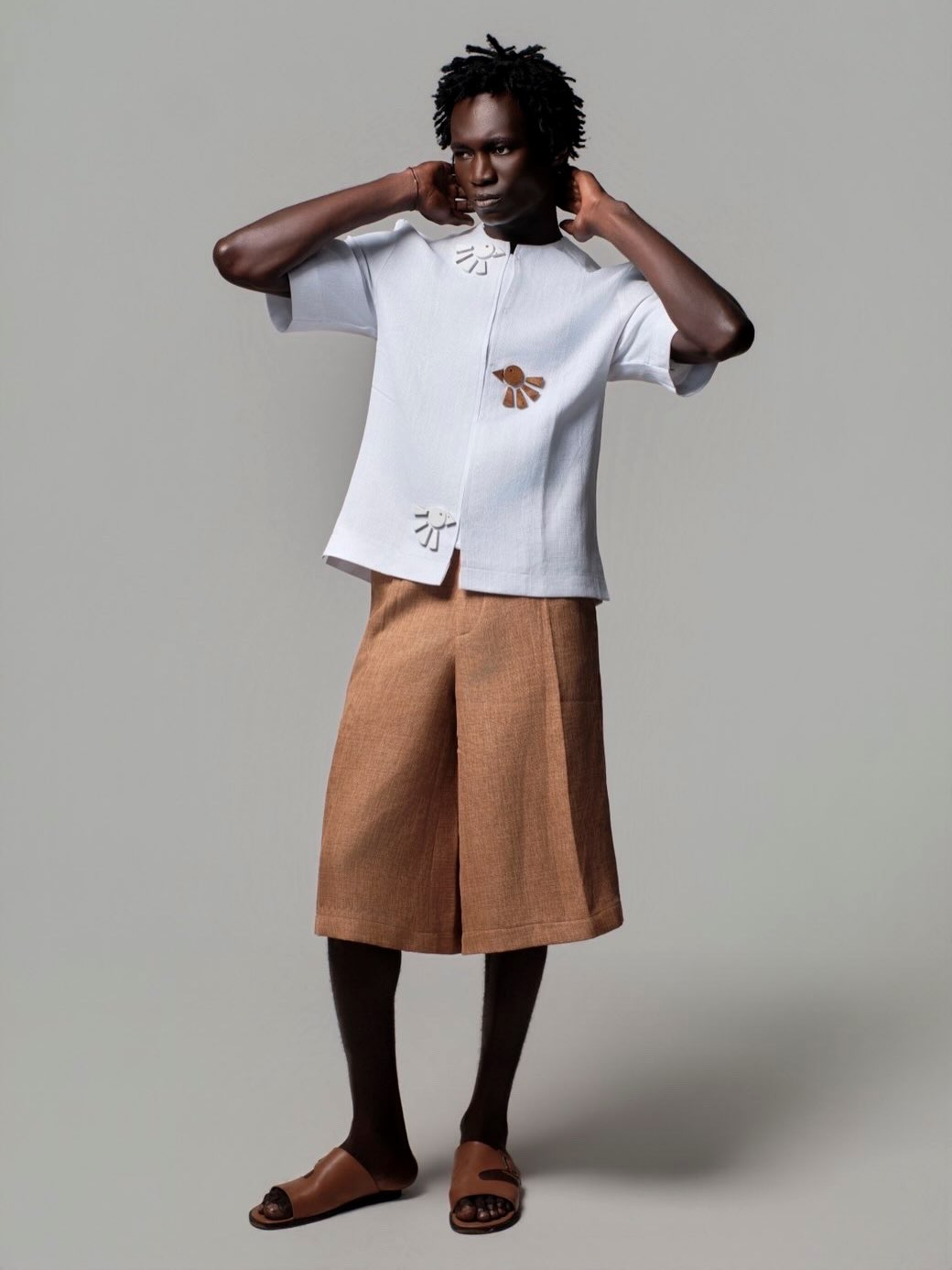 Akyem look one, white linen shirt with hand embroidered motifs and clay wide leg trouser